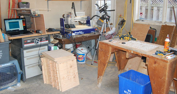 My current ShopBot Desktop set-up with camera, sheets of plywood, computer and workbench.