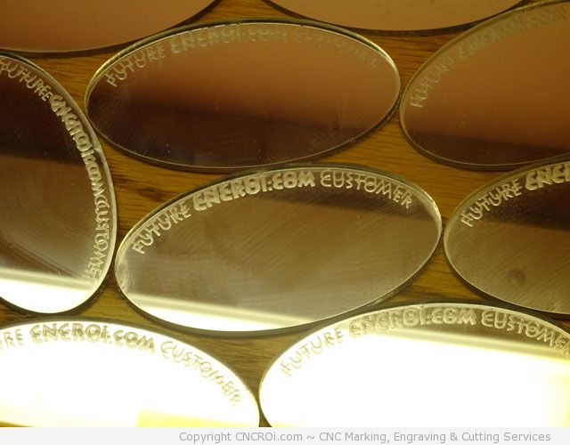 CNC laser engraving and cutting mirrored acrylic